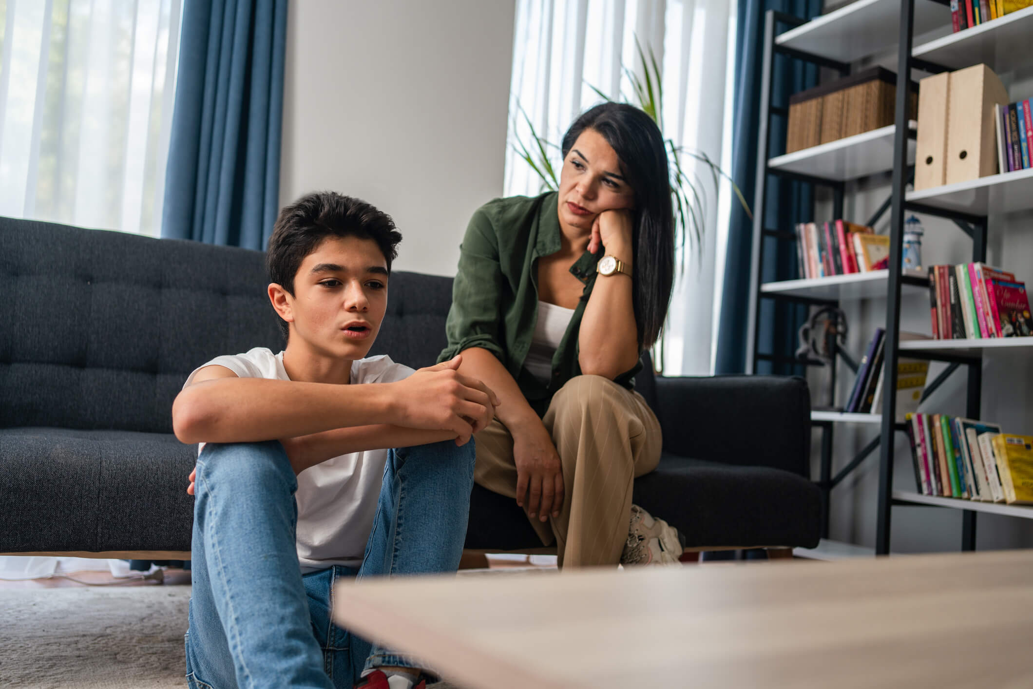 Teen talking with his mother