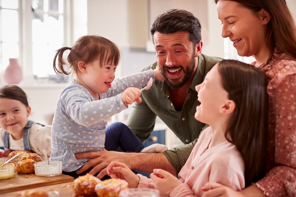 Family laughing together and having fun in the kitchen