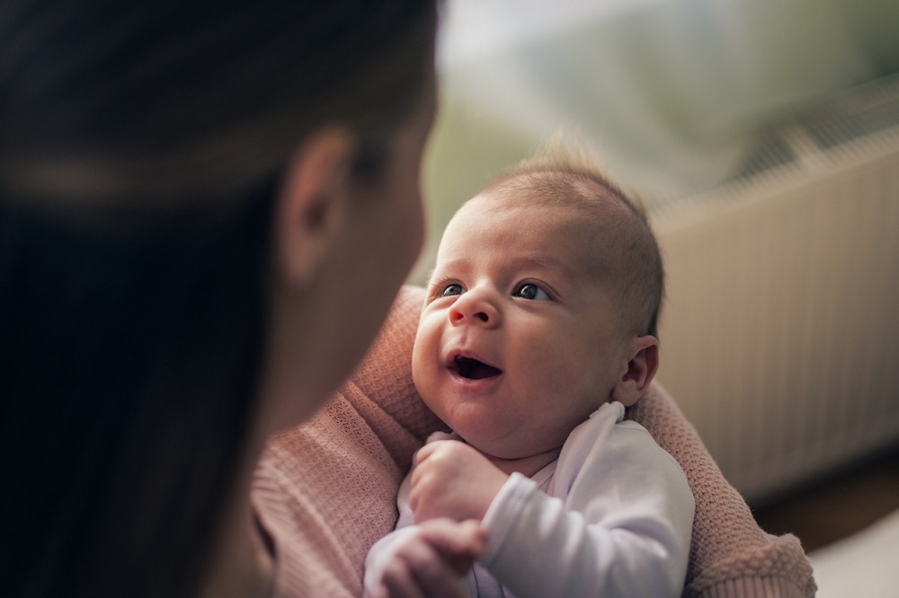 Mother looking at newborn baby