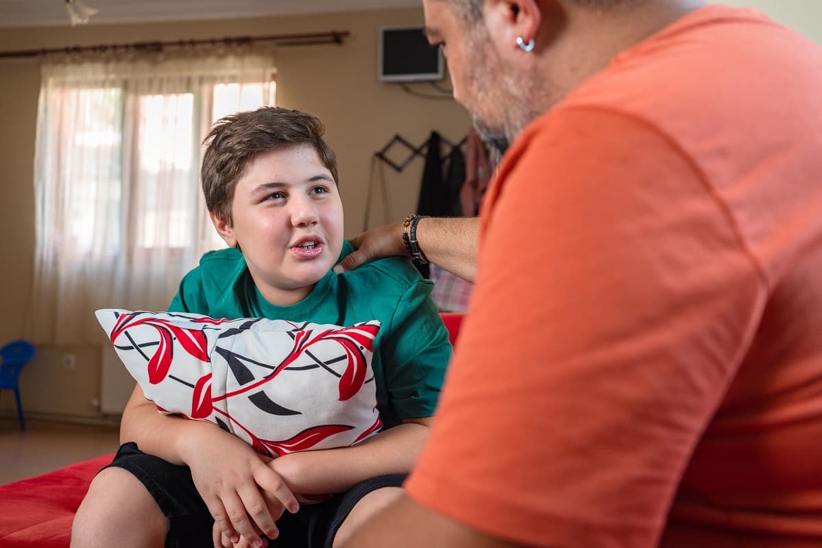 Teen boy talking to his dad