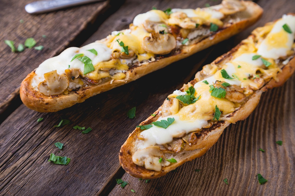 French bread pizza with cheese and mushrooms