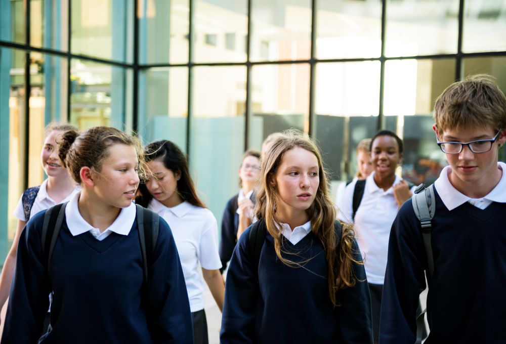 School pupils in uniform outside a school