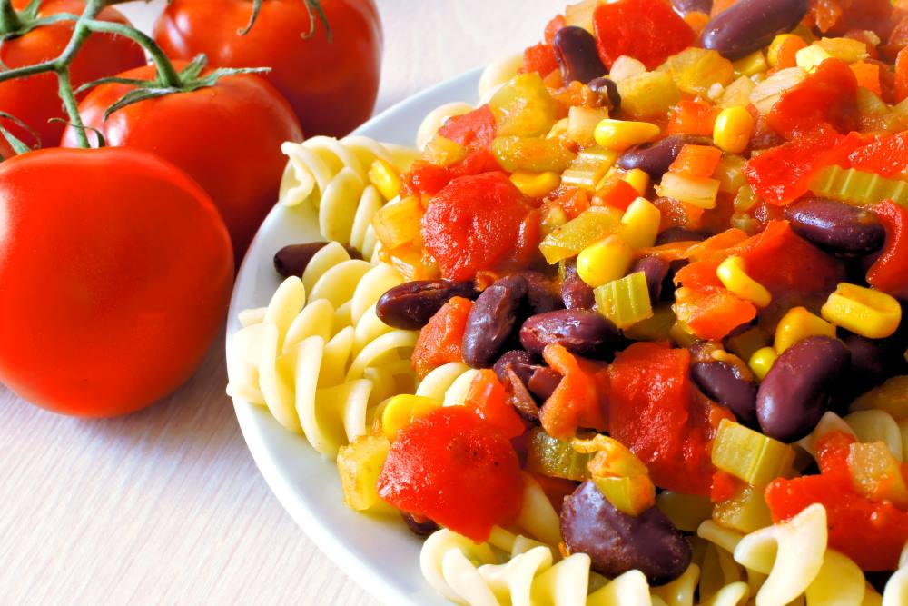 Pasta salad with beans and tomatoes.