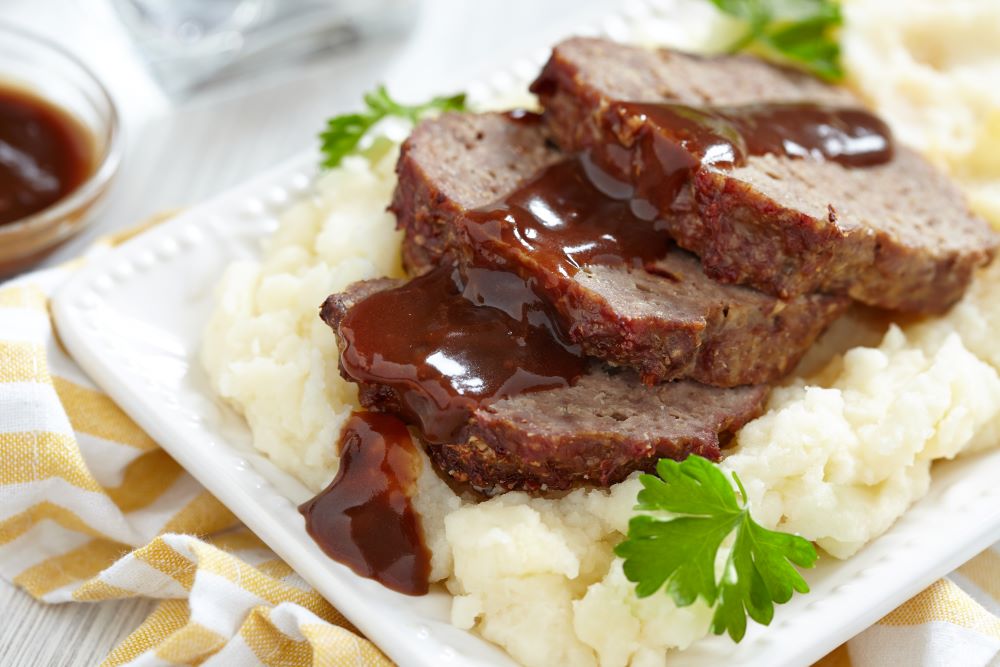 Meatloaf with gravy and mashed potato.