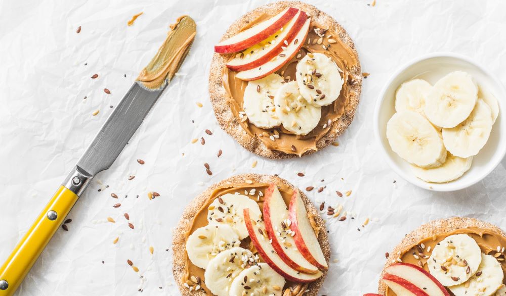 Rice cakes with apple and peanut butter.