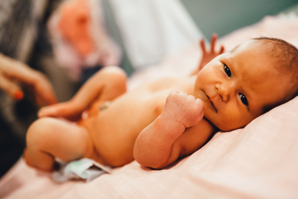 Image of a baby lying on a nappy changing table.