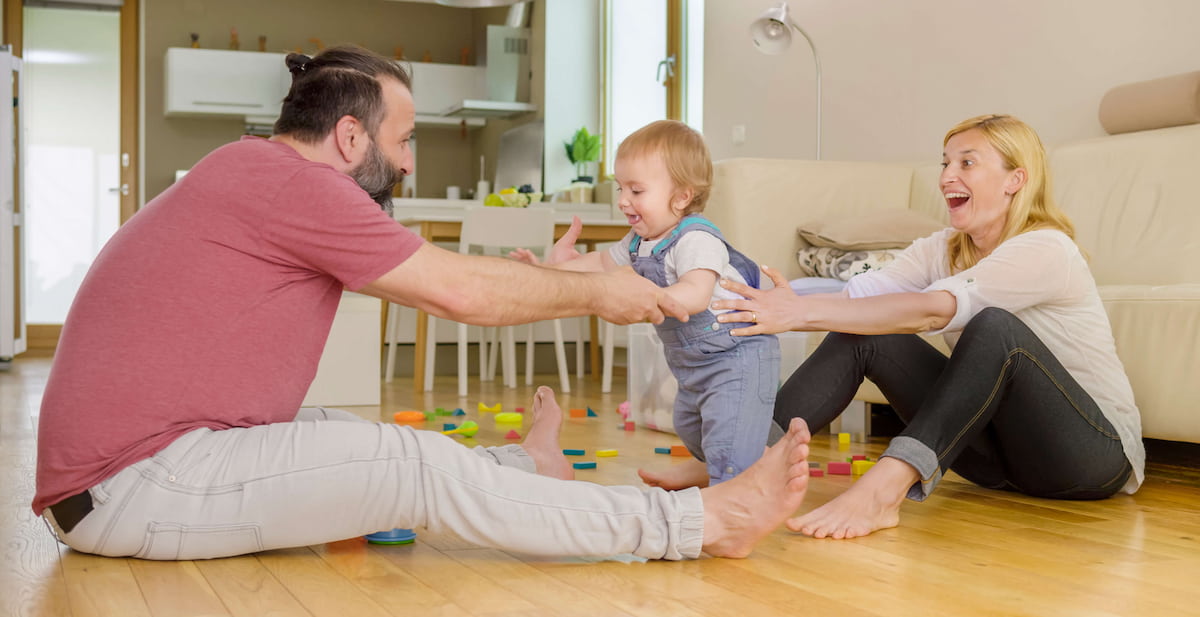 Photo of a baby learning to walk 