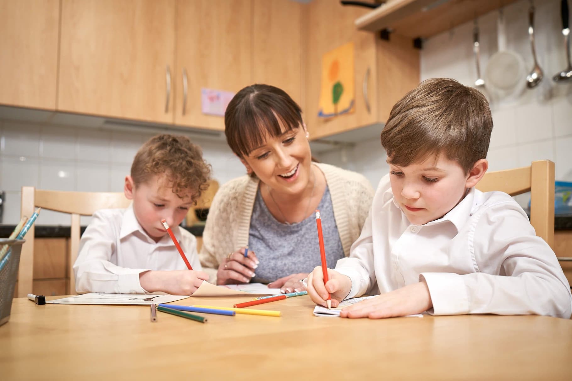 Photo and children drawing at kitchen table