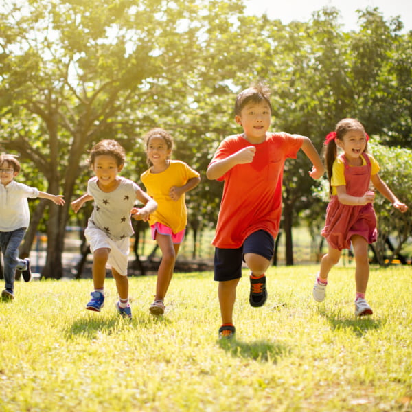 Children running and playing games outdoors