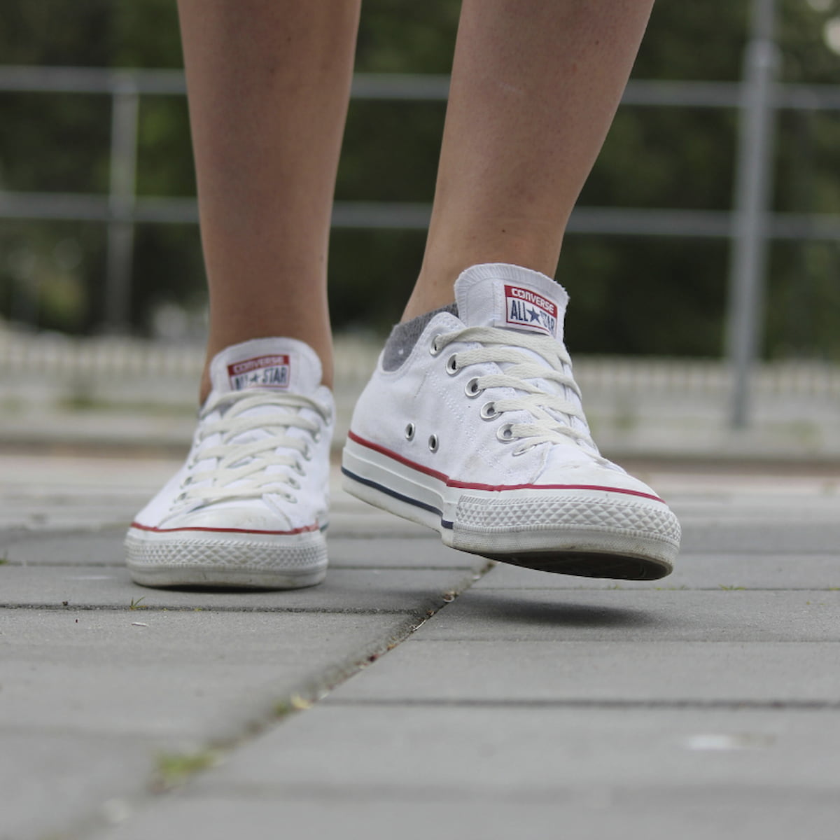 Image of a child's feet running on a playground.