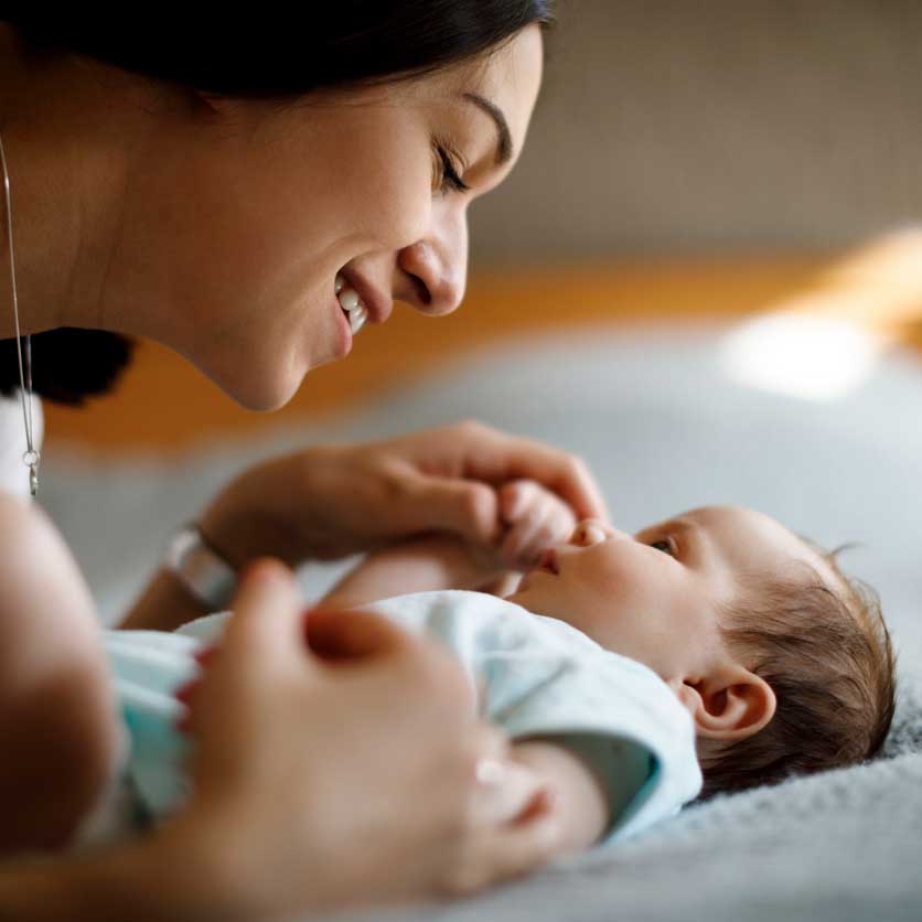 Mother smiling at her baby