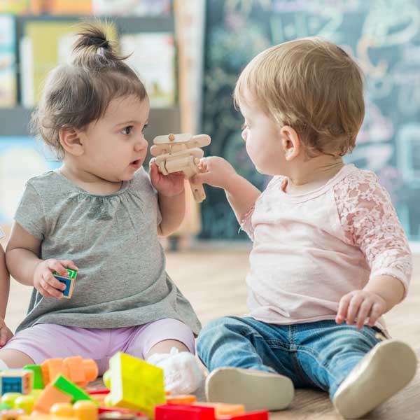 Two babies playing together