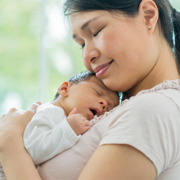 Photo of baby being held by mum