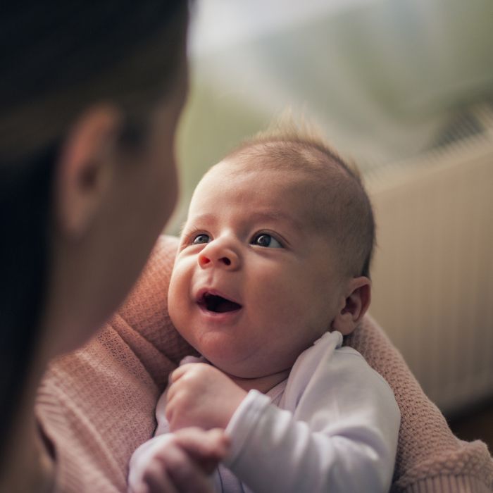 Mum looking at newborn baby