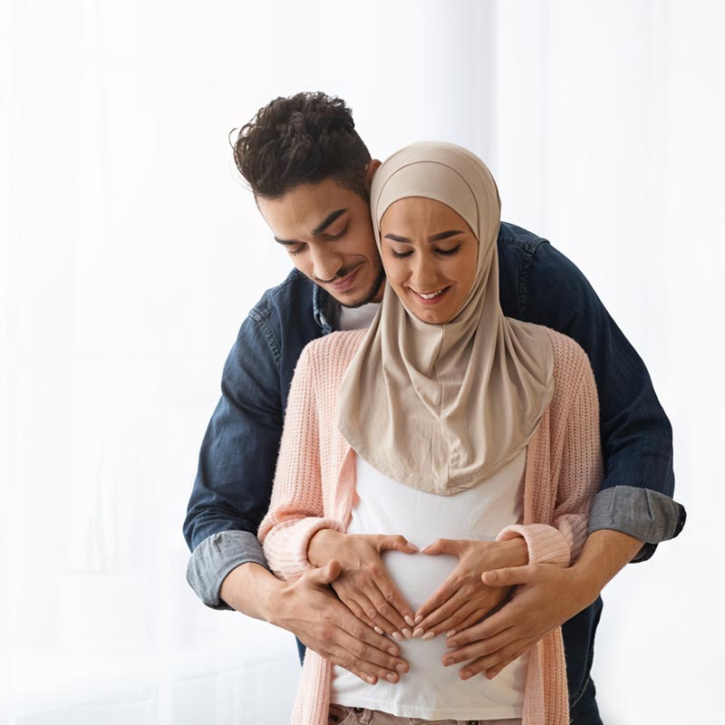 Pregnant couple smiling