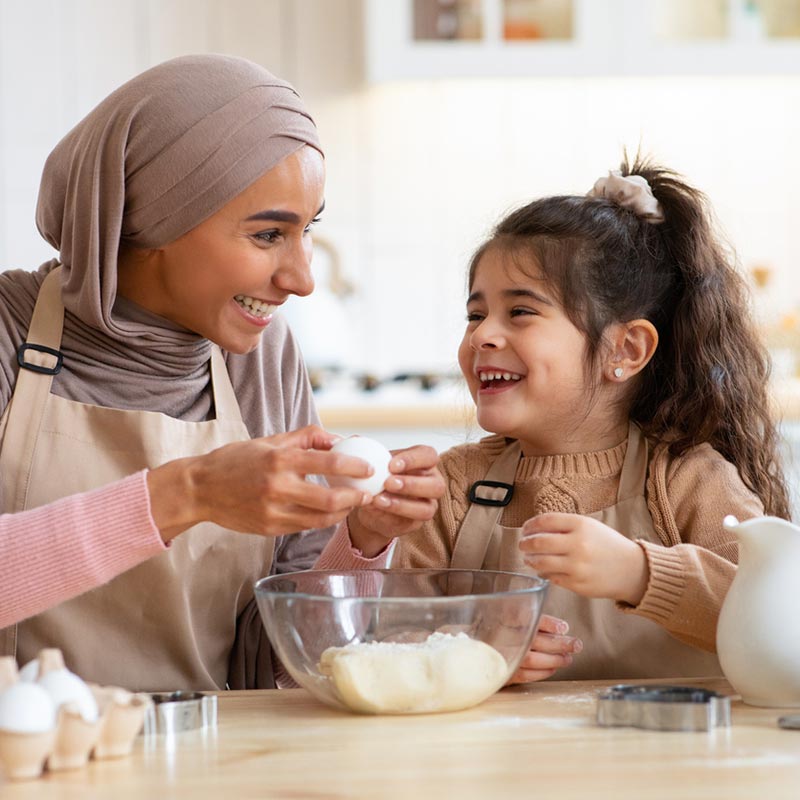 Mum and daughter baking together