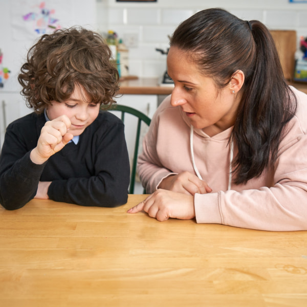 Photo of a mum talking to her son