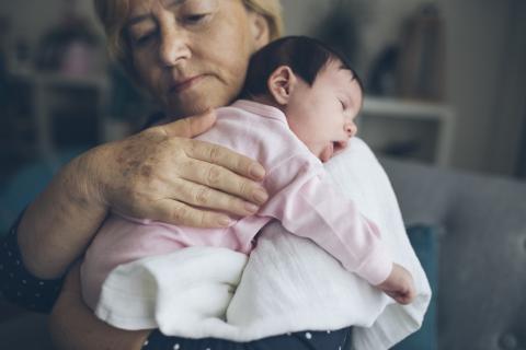 Grandmother holding baby