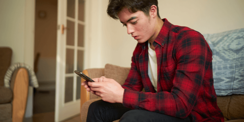 teen-boy-on-mobile-texting-banner