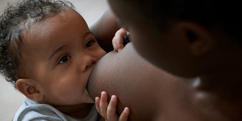 Photo of a baby being breastfed