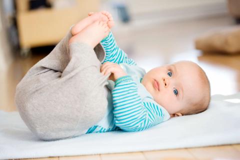 Photo of a baby rolling over 