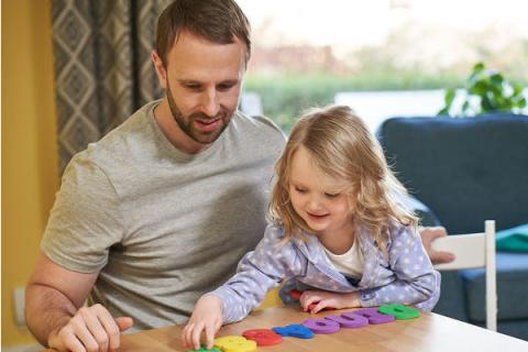 child playing with dad