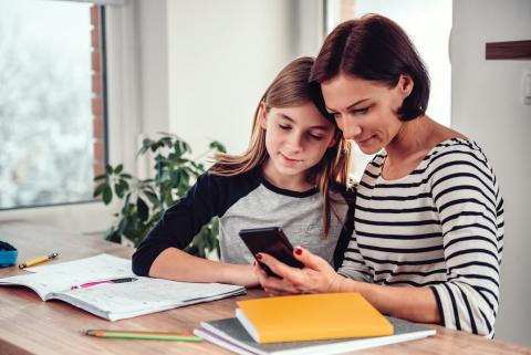 Mother and daughter doing homework together