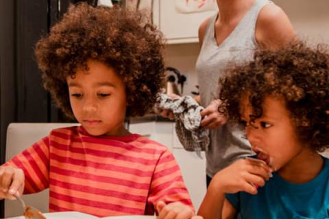 Photo of a family eating together 