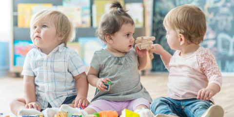 Three babies playing together