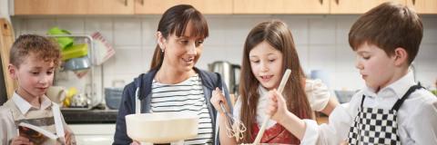 mum cooking with her two children 