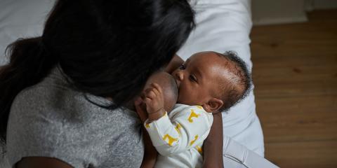 Photo of a mother breast-feeding her baby