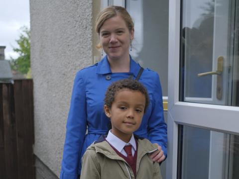 Photo of a child and son ready to go to school 