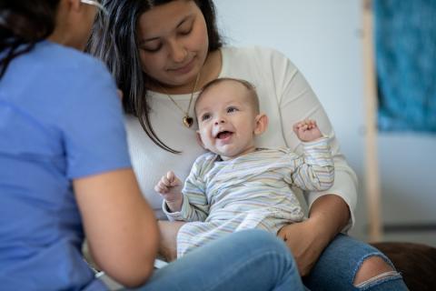 Health visitor with mum and baby