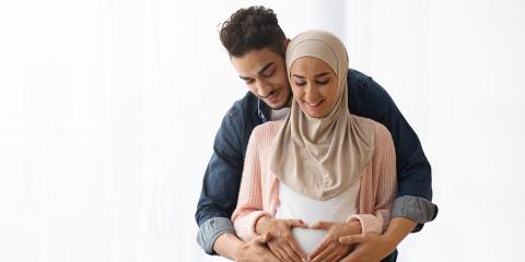 Pregnant couple smiling