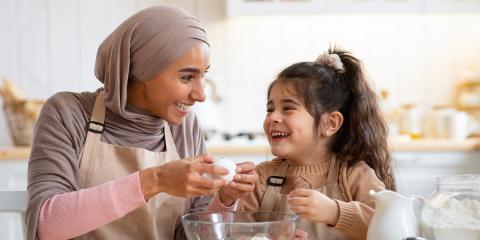 Mum and daughter baking together