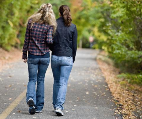 Photo of parents walking along the street 