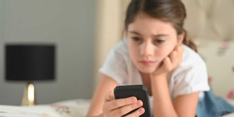 Girl looking at her mobile phone