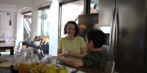 Mother and son talking in the kitchen