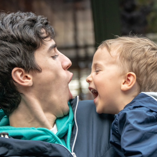 Photo of toddler and father having fun