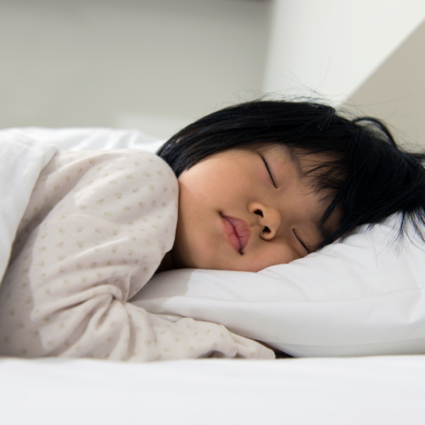 photo of toddler asleep in bed