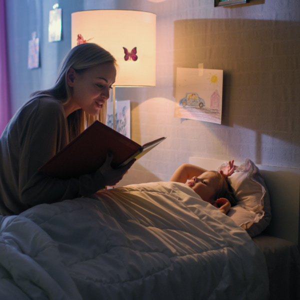 photo of a toddler being read to